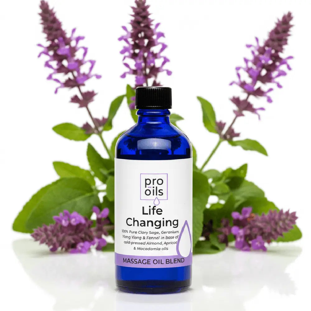 Blue bottle of pro oils massage oil blend with lavender flowers in the background