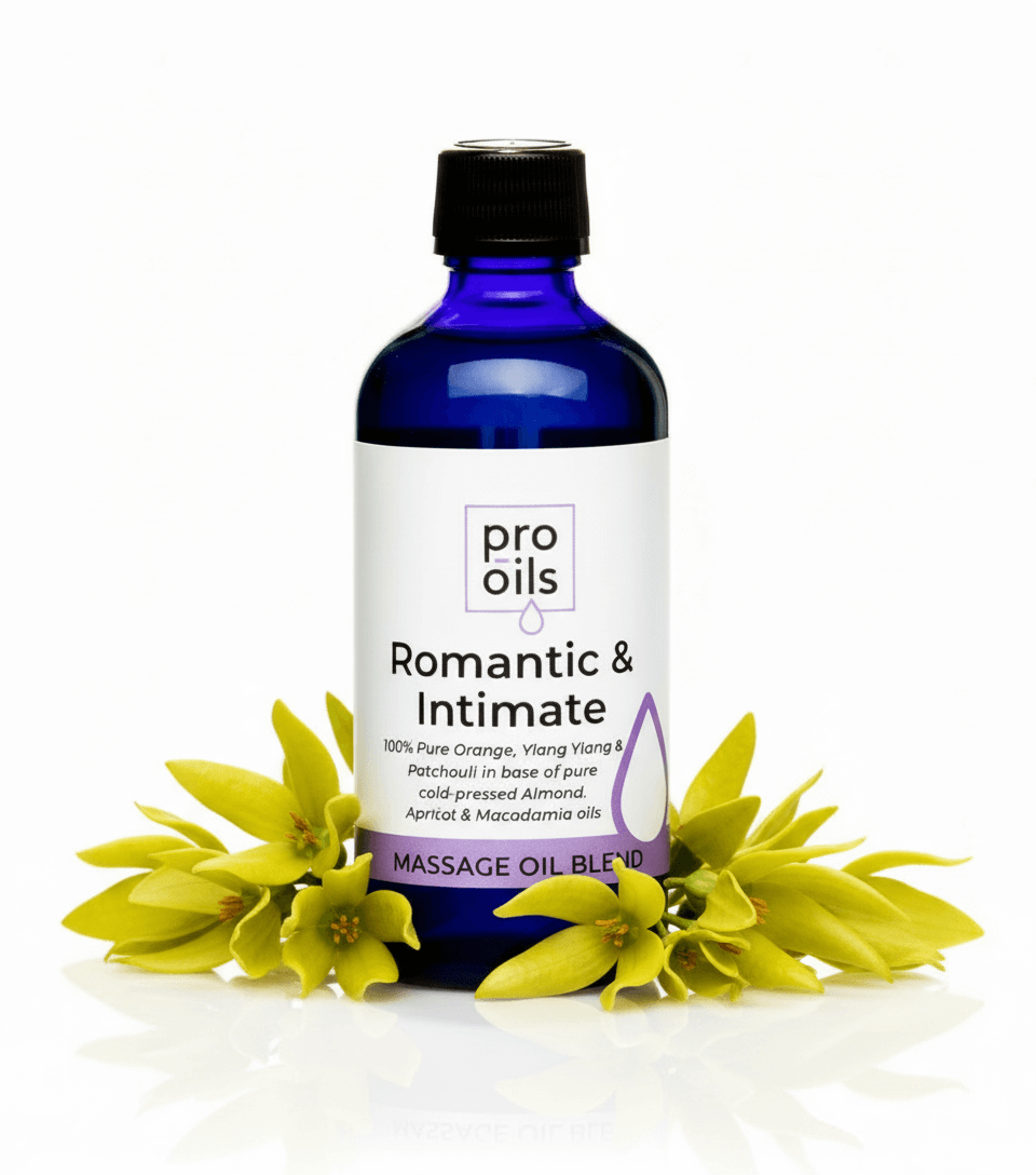 Bottle of Pro Oils Romantic & Intimate massage oil blend with flowers on a white background