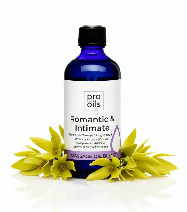 Bottle of Pro Oils Romantic & Intimate massage oil blend with flowers on a white background
