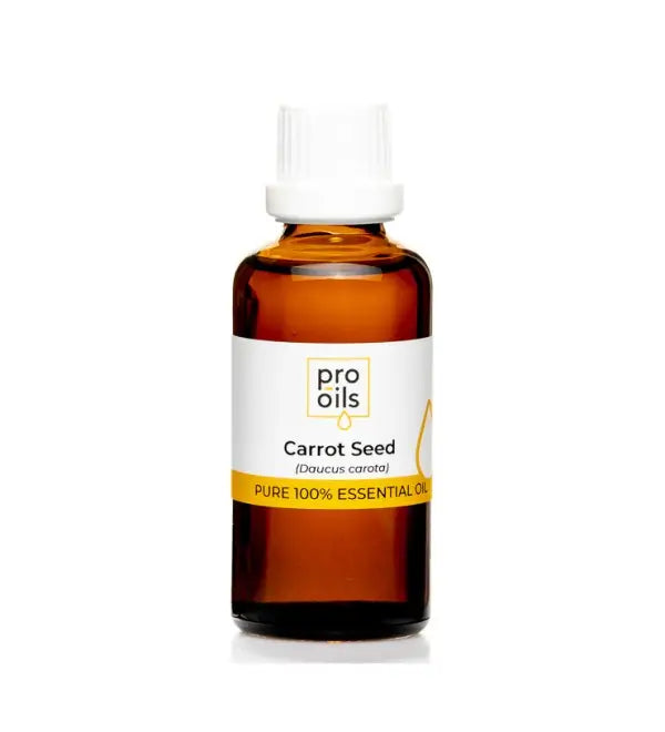 Bottle of carrot seed essential oil with a white label on a white background
