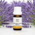 Bottle of Pro Oils Lavender French Alpine essential oil with lavender flowers in the background
