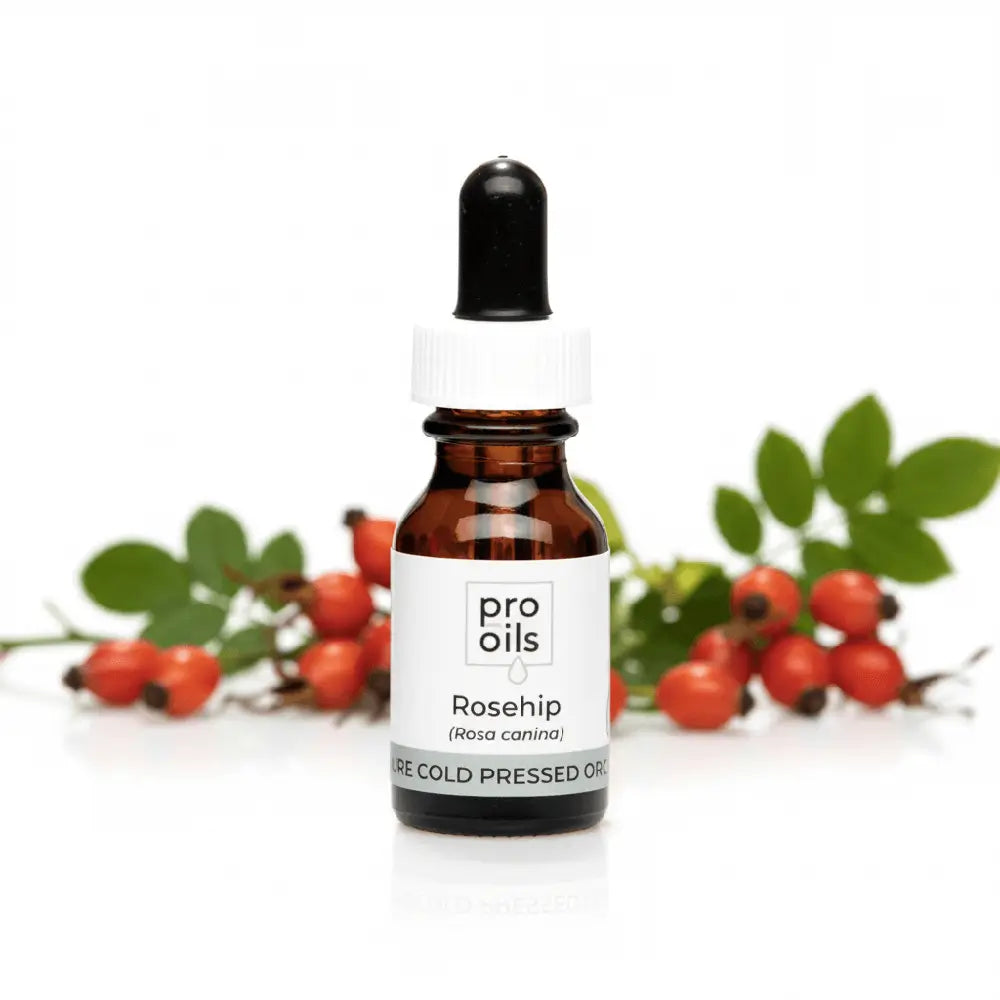 Bottle of Pro Oils Rosehip oil with rosehips on a white background