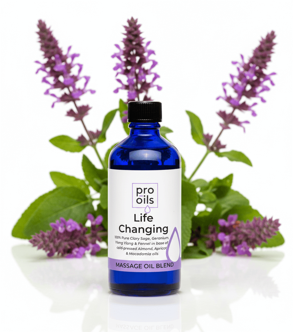 Blue bottle of Pro Oils Life Changing massage oil blend with lavender flowers in the background