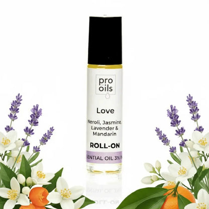 Roll-on essential oil bottle with floral and fruit illustrations on a white background