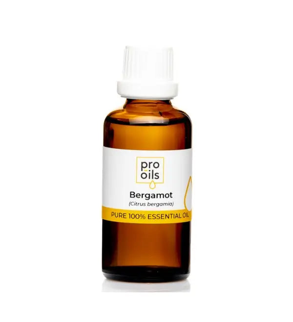 100% pure bergamot essential oil in amber glass bottle with dropper