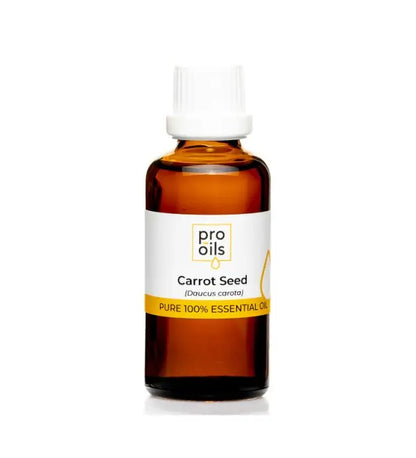 Bottle of carrot seed essential oil with a white label on a white background