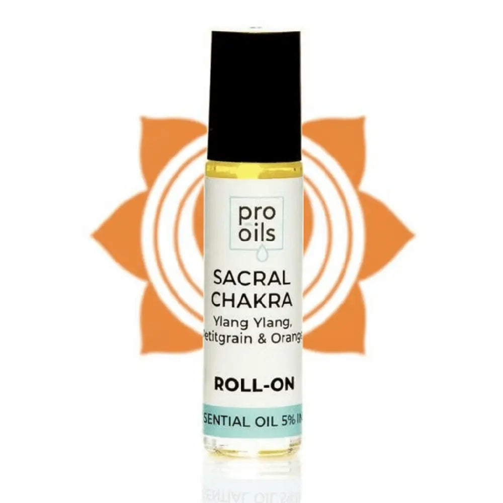 Roll-on bottle of Pro Oils Sacral Chakra essential oil with a sunflower design in the background.