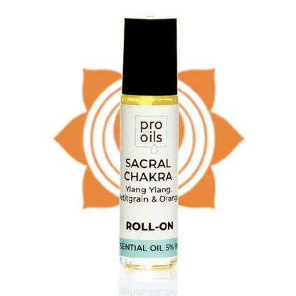 Roll-on bottle of Pro Oils Sacral Chakra essential oil with a sunflower design in the background.