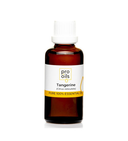 Tangerine essential oil bottle with fresh tangerines and leaves, showcasing its natural aroma and benefits.